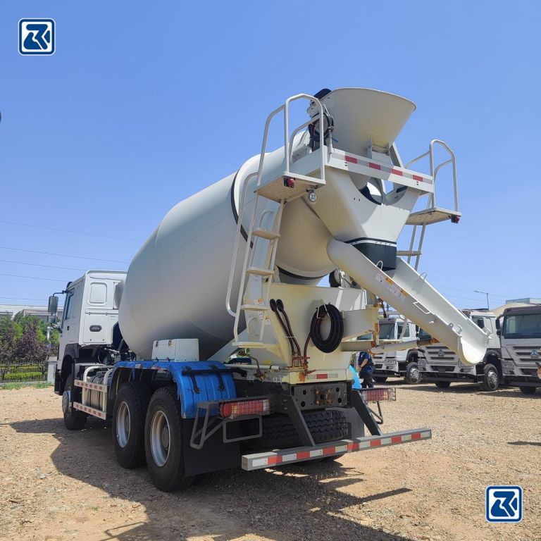 Rear view of a HOWO concrete mixer truck showing the drum and chute to be cleaned